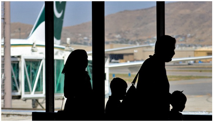 Passengers leave to board on a Pakistan International Airlines plane at the airport in Kabul, Afghanistan, on September 13, 2021. Photo— AFP
