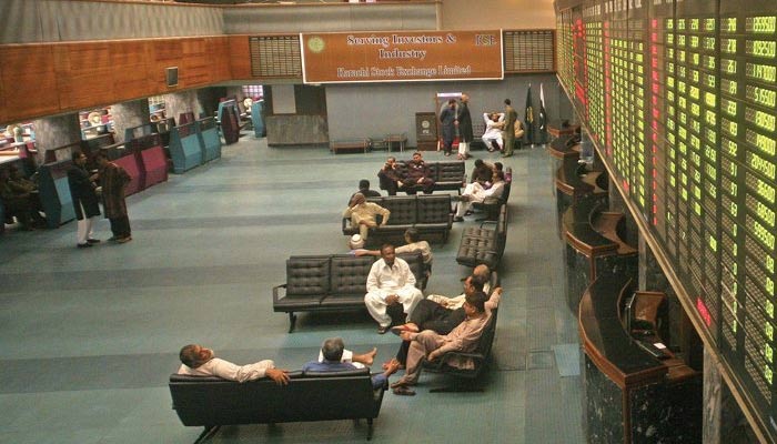 Investors and traders are sitting in the main hall of Pakistan Stock Exchange. — AFP/File