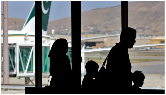 Passengers leave to board on a Pakistan International Airlines plane at the airport in Kabul, Afghanistan, on September 13, 2021. Photo — AFP