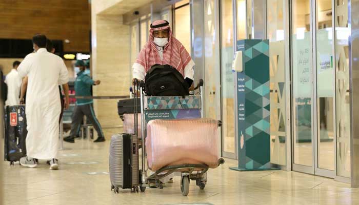 A Saudi man wearing a face mask is seen with his luggage as he arrives at the King Khalid International Airport, after Saudi authorities lift the travel ban on its citizens after fourteen months due to Coronavirus (COVID-19) restrictions, in Riyadh, Saudi Arabia, May 16, 2021. — Reuters/Ahmed Yosri