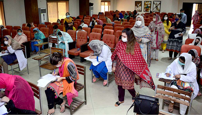 Shaheed Benazir Bhutto Women University faculty members inspecting exam room as students attempt their papers in Peshawar on September 15. — APP/File