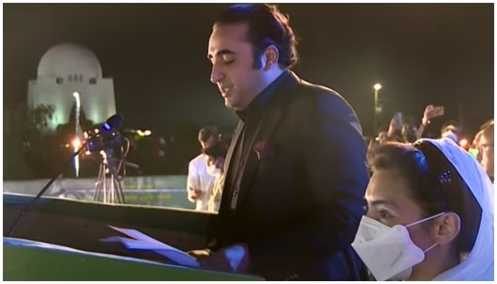 PPP Chairperson Bilawal Bhutto-Zardari (L) delivers a speech during a rally in Karachi on October 17, 2021, while his sister, Aseefa Bhutto-Zardari, stands next to him. — Screengrab via Hum News Live.