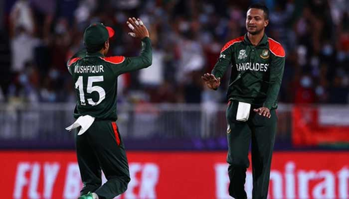 Shakib Al Hasan (R) celebrating reaching the milestone with Mushfiqur Rahim, in Muscat, Oman, on October 17, 2021. — Twitter/@T20WorldCup