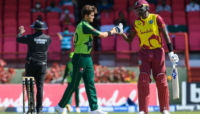 Jason Holder (R) of the West Indies congratulate Shareen Afridi (L) of Pakistan for winning the 2nd T20I match between the West Indies and Pakistan at Guyana National Stadium in Providence, Guyana, on July 31, 2021. — AFP