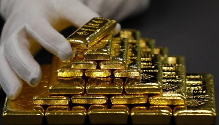 An employee sorts gold bars in the Austrian Gold and Silver Separating Plant Oegussa in Vienna, Austria, December 15, 2017. — Reuters/File