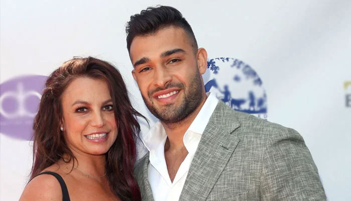 Britney Spears, Sam Asghari gleefully ride motorcycles in the driveway