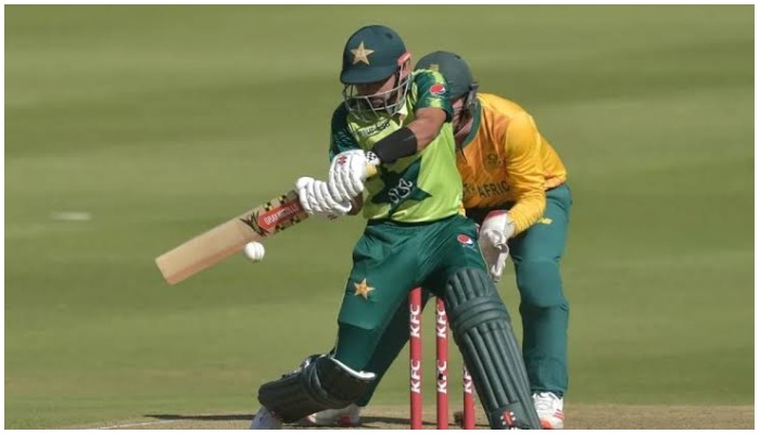 A Pakistan batter plays a shot while a South African wicket keeper tries to catch the ball. Photo: AFP