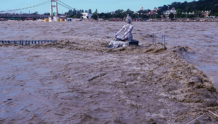 A statue of Hindu god Lord Shiva is pictured amid rising water levels of River Ganga after incessant rains in Rishikesh in Indias Uttrakhand state. Photo: AFP