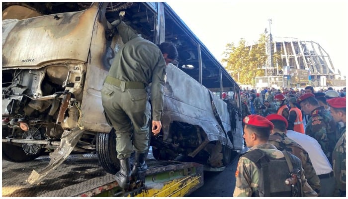 Security forces inspect the site of an explosion in central Damascus, Syria October 20, 2021. REUTERS