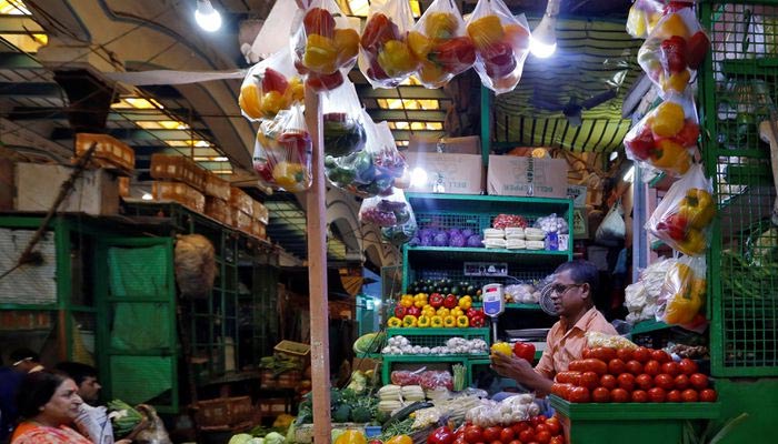 A vendor sells vegetables at a retail market in Kolkata, India, on December 12, 2018. — REUTERS/File