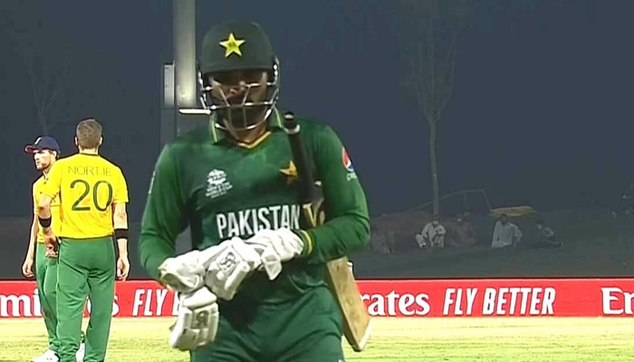 Pakistani batsman Asif Ali walks back to the pavilion after being dismissed during the T20 World Cup warm-up match at Abu Dhabi on October 20, 2021. — Twitter