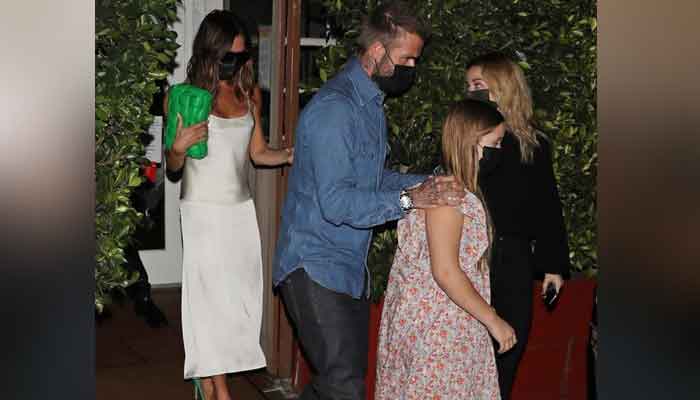 Victoria Beckham looks ultra glamorous as she enjoys family dinner with husband David and daughter Harper