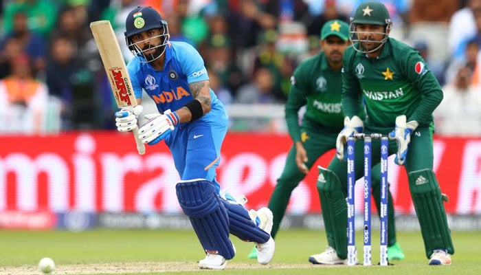 Indian batsman Virat Kohli played a stroke as wicketkeeper Sarfaraz Ahmed, Babar Azam look on. Photo: AFP