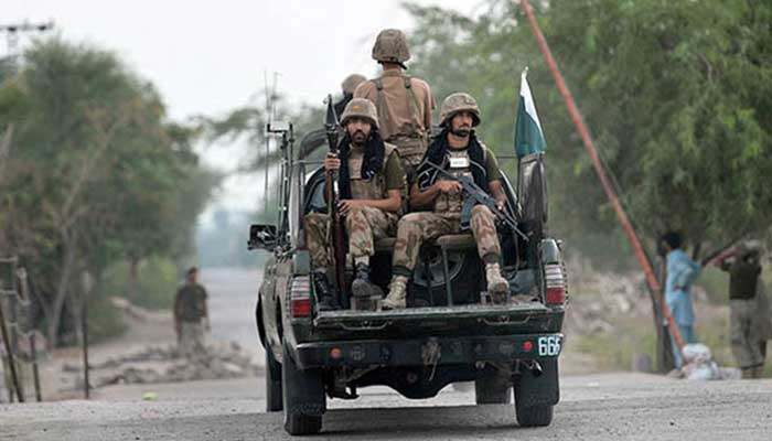 FC personnel aboard a vehicle patrol an area. Photo: AFP/file