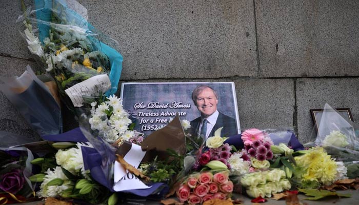 Floral tributes to British MP David Amess, who was stabbed to death during a meeting with constituents, lay outside the Houses of Parliament, in London, Britain, October 19, 2021. — Reuters/File
