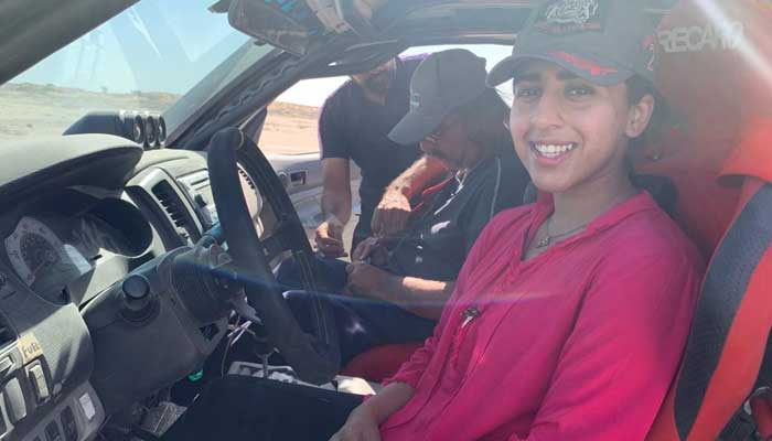 Mahum Shiraz poses for a picture from inside her jeep.