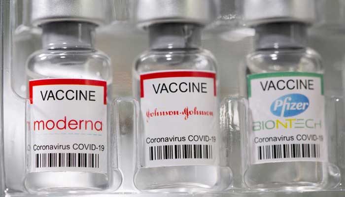 Vials labelled Moderna, Johnson & Johnson, Pfizer-BioNTech coronavirus disease (COVID-19) vaccine are seen in this illustration picture taken May 2, 2021. — Reuters/Dado Ruvic/File Photo