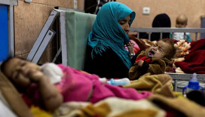 Farzana, 30, holds her one-year-old baby, Omar, at the malnutrition ward for infants of Indira Gandhi Childrens hospital in Kabul, Afghanistan, October 23, 2021. — Reuters/Jorge Silva