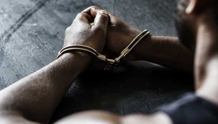 A shutterstock photo showing a man after getting arrested.