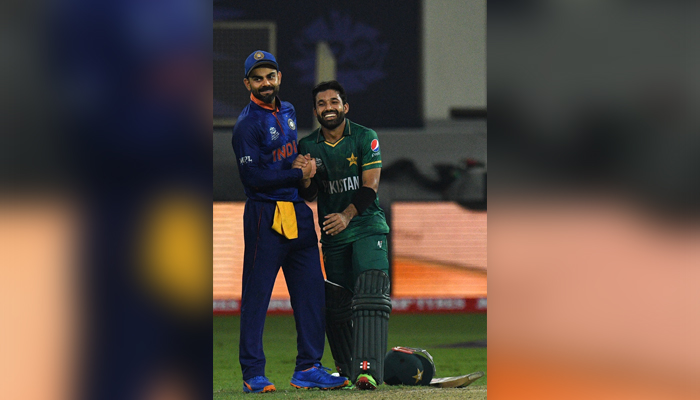 India´s captain Virat Kohli (L) greets Pakistan´s Mohammad Rizwan at the end of the ICC menâ€™s Twenty20 World Cup cricket match between India and Pakistan at the Dubai International Cricket Stadium in Dubai on October 24, 2021. — AFP