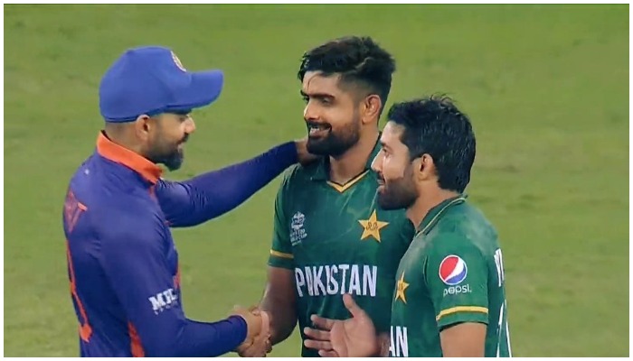 Indian skipper Virat Kohli (left) congratulates captain Babar Azam (centre) and Mohammad Rizwan (left). — Twitter