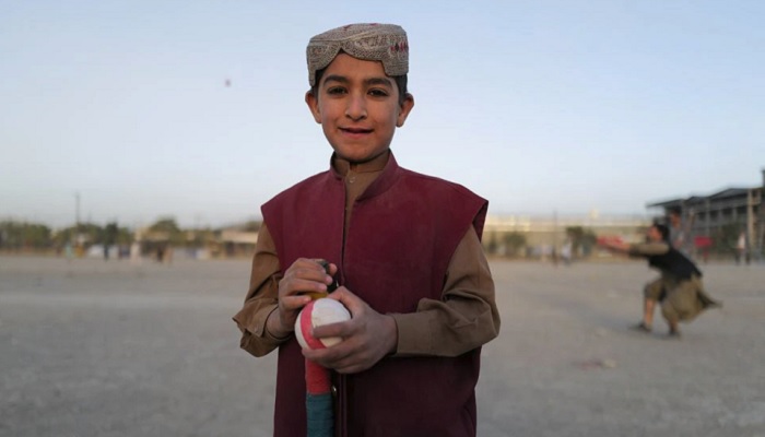 Khobiab, 7, from Kandahar province and who is learning how to play cricket poses for a photograph at a playground in Kabul, Afghanistan October 22, 2021. Photo: Reuters