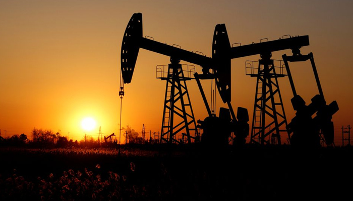Pumpjacks are seen against the setting sun at the Daqing oil field in Heilongjiang province, China December 7, 2018. Picture taken December 7, 2018. — Reuters/File
