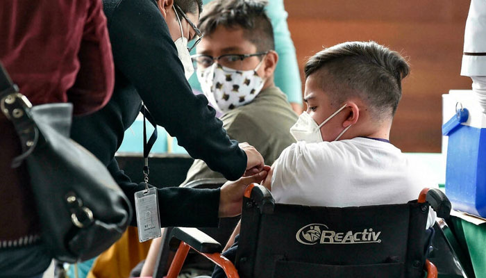 Mexico City starts Covid vaccinations of minors at risk