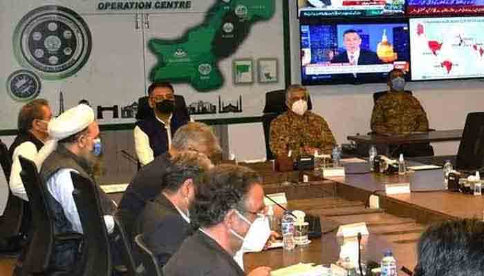 Federal Minister for Planning, Development, and Special Initiatives Asad Umar chairs a meeting at the National Command and Operation Centre. Photo: file