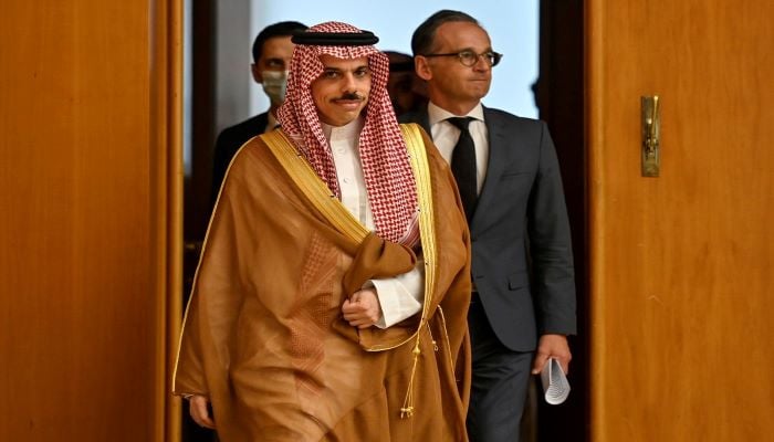 Saudi Foreign Minister Prince Faisal bin Farhan arrives with German Foreign Minister Heiko Maas for a joint news conference in Berlin, Germany August 19, 2020. Photo: Reuters