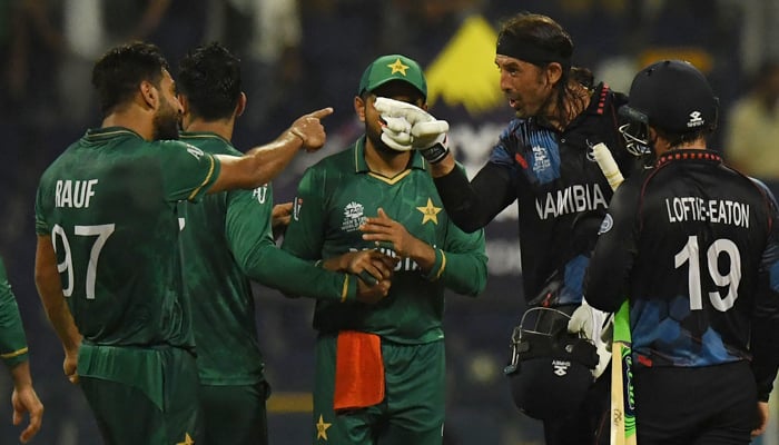 Namibia´s David Wiese (2R) gestures towards Pakistan´s Haris Rauf (L) after the end of play in the ICC Twenty20 World Cup cricket match between Namibia and Pakistan at the Sheikh Zayed Cricket Stadium in Abu Dhabi on November 2, 2021. — AFP