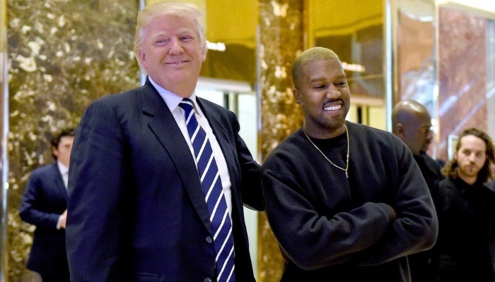 I still got a red hat on today. I’ll let y’all know that, said Kanye West about Donald Trump