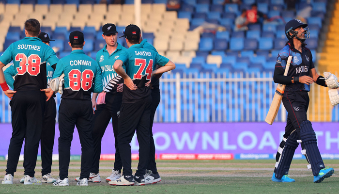 New Zealand´s players celebrate after the dismissal of Namibia´s David Wiese (R) during the ICC Twenty20 World Cup cricket match between Namibia and New Zealand at the Sharjah Cricket Stadium in Sharjah on November 5, 2021. — AFP