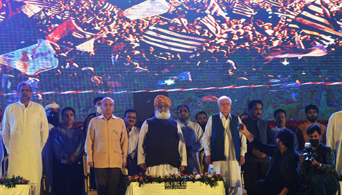 Maulana Fazlur Rehman (C), leader of the Pakistan Democratic Movement (PDM), an anti-government alliance of opposition parties, stands with other leaders during an anti-Government rally in Karachi on August 29, 2021. — AFP/File