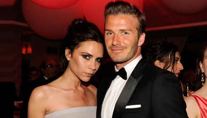 Victoria Beckham makes fun of her husband David Beckham as he runs away from fireworks
