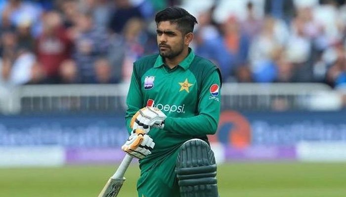 Pakistan cricket teams top-order batsman Babar Azam while posing on the cricket field. — ICC