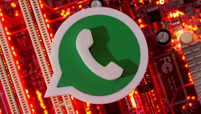 In this illustration, a 3D-printed Whatsapp logo is placed on a computer motherboard taken on January 21, 2021. — Reuters/File