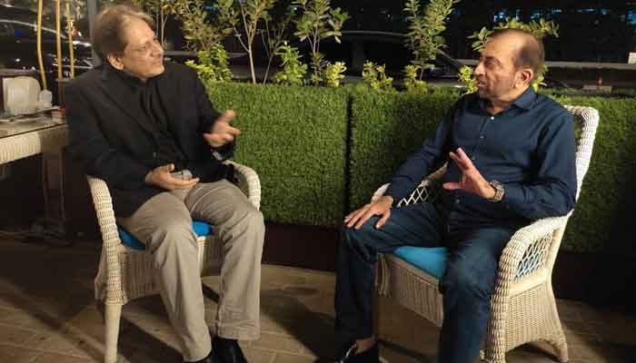 Former Sindh governor Dr Ishratul Ebad (left) gestures as he speaks to Dr Farooq Sattar.