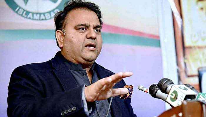 Fawad Chaudhry gestures as he speaks at a ceremony. Photo: APP