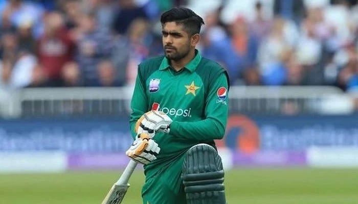 Pakistan cricket teams top order batsman Babar Azam poses with the bat on a cricket field. Photo: Geo.tv/ file