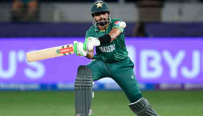 Pakistans captain Babar Azam plays a shot during the ICC Mens Twenty20 World Cup semi-final match between Australia and Pakistan at the Dubai International Cricket Stadium in Dubai on November 11, 2021. -AFP