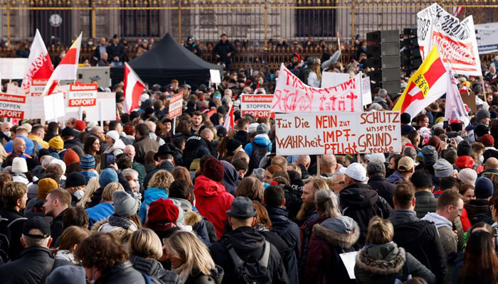 Demonstrators hold flags and placards as they gather to protest against the coronavirus disease (COVID-19) measures in Vienna, Austria, November 20, 2021.— Reuters