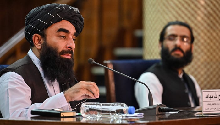 Taliban spokesman Zabiullah Mujahid (L) and Intelligence Service spokesman, Khalil Hamraz participate in a press conference at the government media and information center in Kabul, on November 10, 2021. — AFP/File