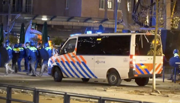 In this image taken from a video, the police arrive as demonstrators protest against government restrictions due to the coronavirus pandemic, on Nov 19, 2021, in Rotterdam, Netherlands. Agencies