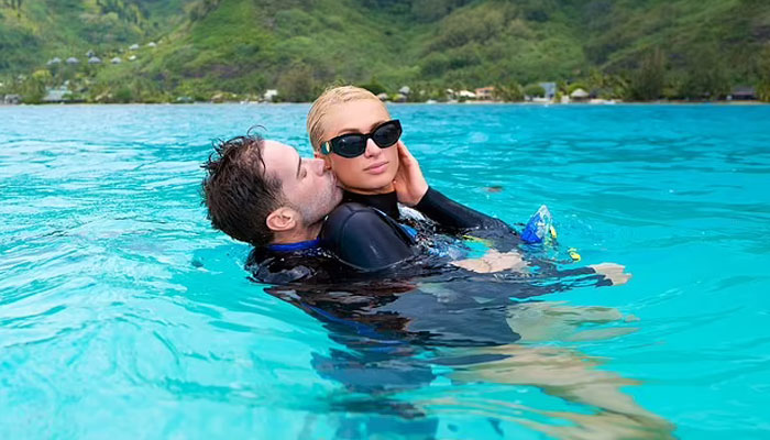 Paris Hilton, Carter Reum pack on the PDA during South Pacific honeymoon
