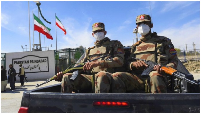 Pakistani soldiers wearing facemasks patrol near Pakistan-Iran border in Taftan on February 25, 2020. —AFP