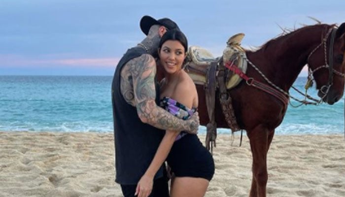 Travis Barker embraces Kourtney Kardashian in loved-up photos from Mexico