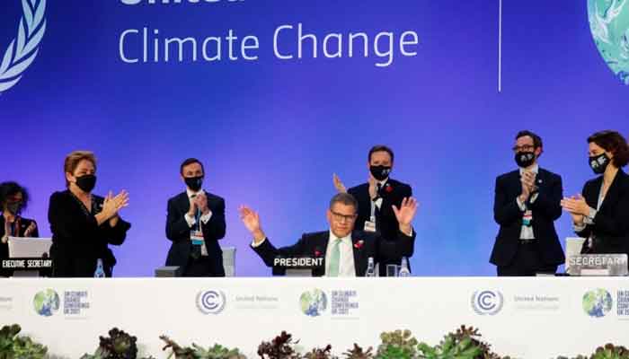 COP26 President Alok Sharma gestures as he receives applause during COP26, the UN Climate Change Conference in Glasgow on November 13, 2021. Photo: Phil Noble/Reuters