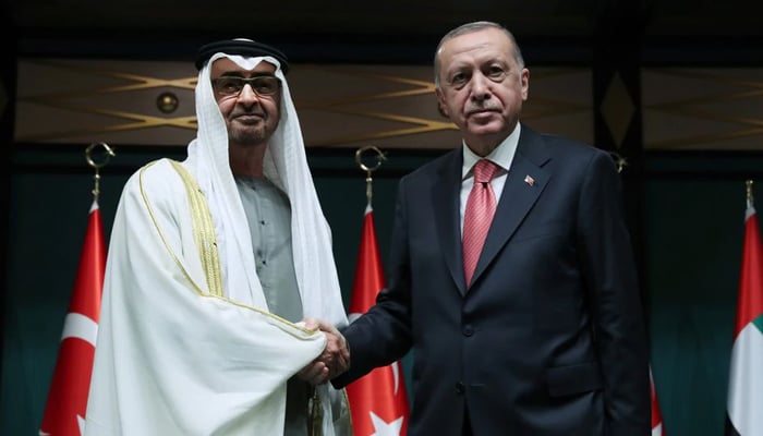 Turkish President Tayyip Erdogan shakes hands with Abu Dhabi Crown Prince Sheikh Mohammed bin Zayed al-Nahyan during their meeting in Ankara, Turkey November 24, 2021. — Reuters
