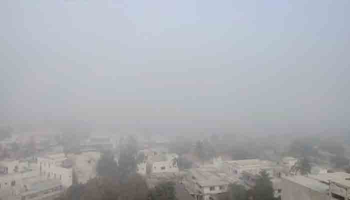 Fog blankets Karachi’s North Nazimibad area early Thursday.